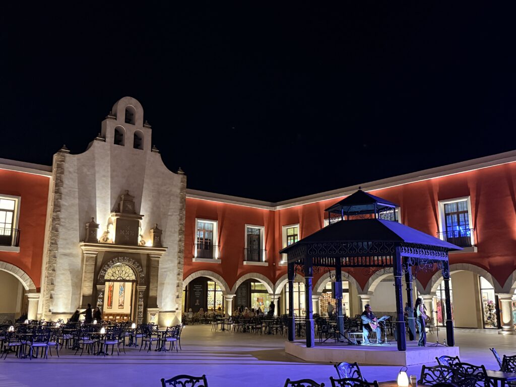 Spanish colonial-style plaza with live music at Majestic Mirage Costa Mujeres